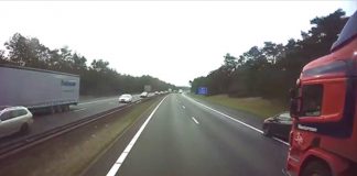 Automobilist haalt twee vrachtwagens in via de vluchtstrook