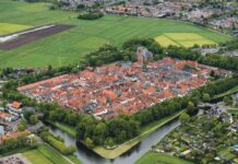 Gluren bij de buren: Flaneren langs flamingo’s en zandverhalen